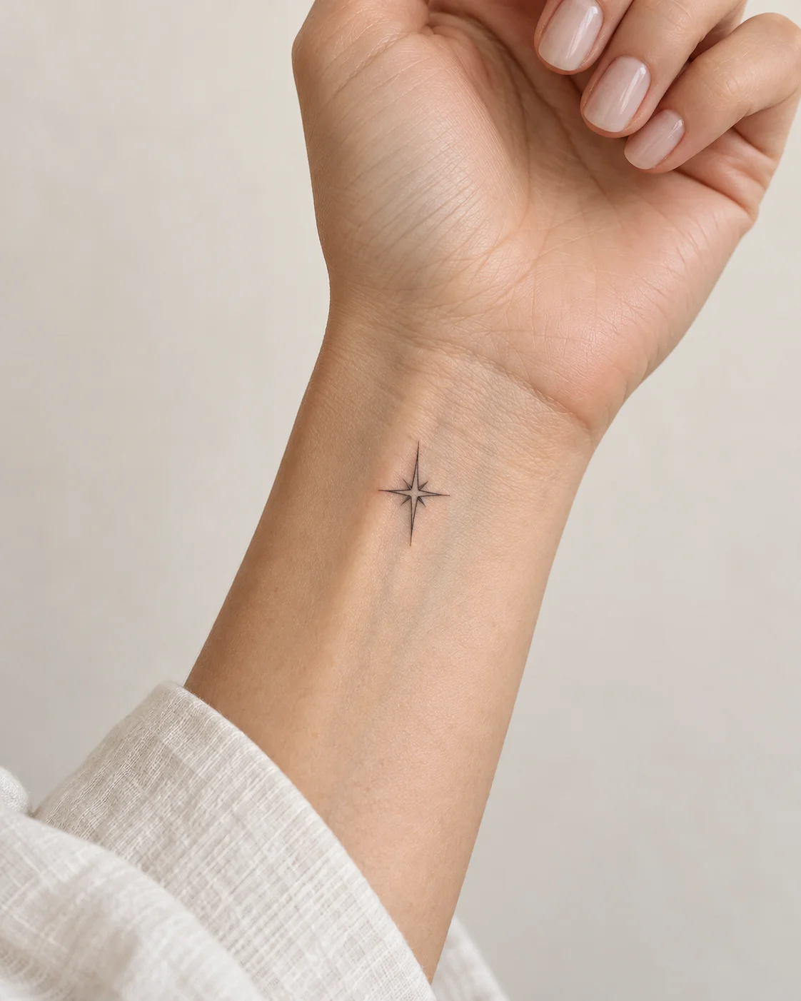 Tiny North Star fine line tattoo concept on the inner wrist