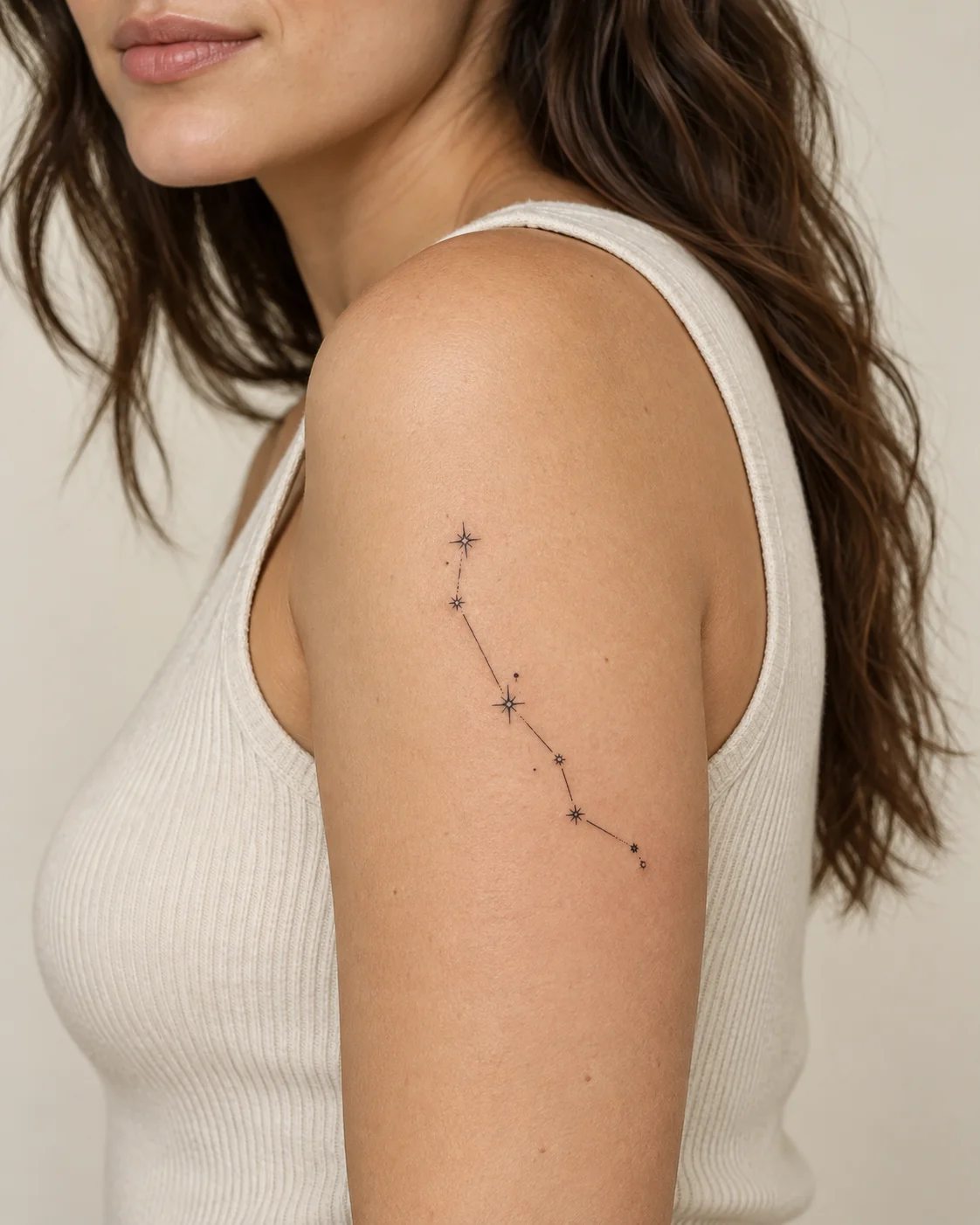 Minimal Constellation fine line tattoo concept on the outer upper arm
