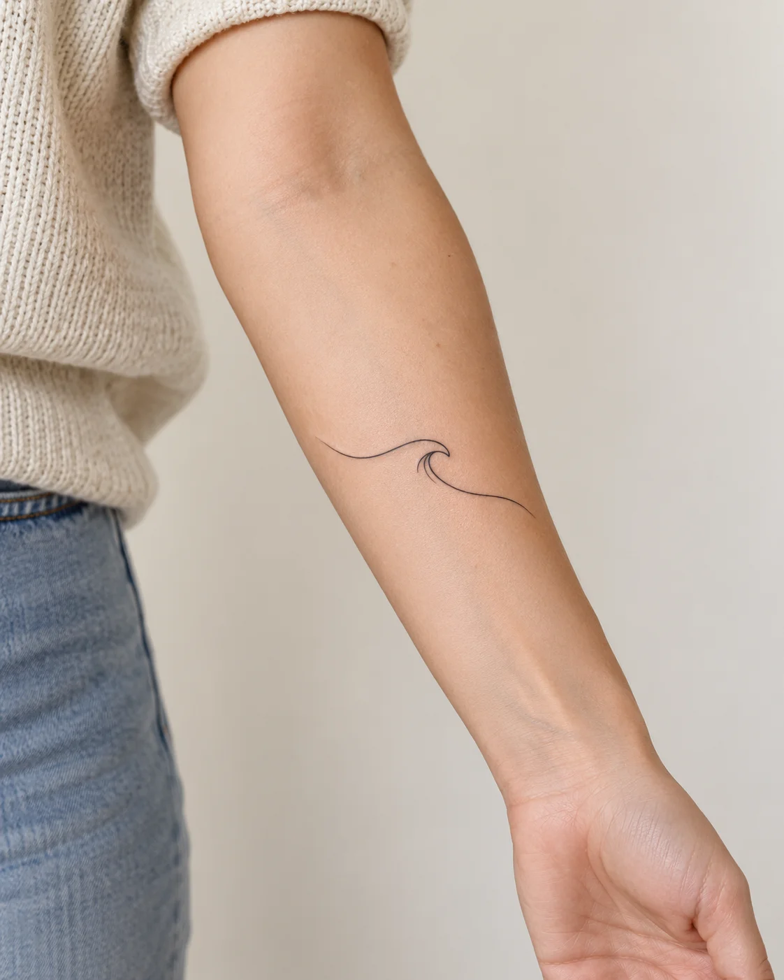 Single Fine Wave fine line tattoo concept on the inner forearm