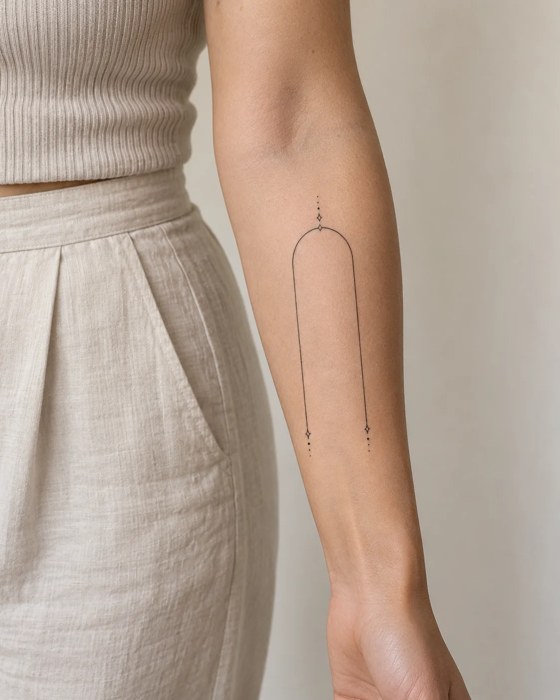 Fine Arch Shape fine line tattoo concept on the outer forearm